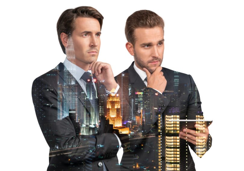 Two handsome businessmen in suits, using tablet device and pensively thinking. Asia corporate lifestyle, communication of diverse young professionals. Night Kuala Lumpur city view. Double exposure